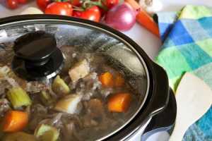 Simmering Slow Cooker Meal with Wooden Spatula | Vitacost.com/Blog