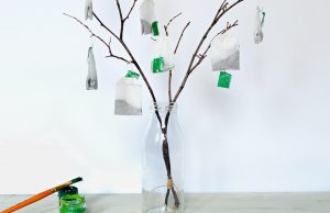 Decorative Tree in Glass Bottle With Tea Bags Dangling From Branches | Vitacost.com/blog
