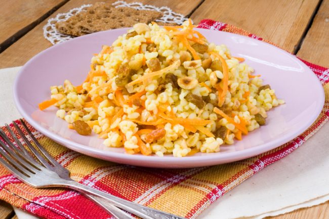 Sorghum Salad Sprinkled with Curried Carrots and Raisins on Plate | Vitacost.com/blog