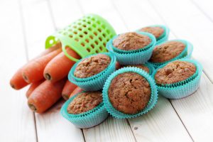 Gluten-Free Carrot Cake Muffins in Blue Muffin Liners with Carrots | Vitacost.com/blog