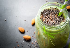 Green Smoothie in Jar, Topped with Chia & Flax Seeds
