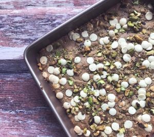 White Chocolate & Pistachio Blonde Brownies in Baking Dish on Wood #recipe | Vitacost.com/blog