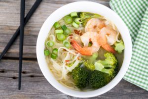 White Bowl with Shrimp, Broccoli & Noodle Soup, Chopsticks and Napkin on Wood | Vitacost.com/blog