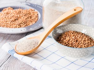 Gluten-Free Buckwheat Gran and Flour in Bowls with Wooden Spoon | Vitacost.com/Blog