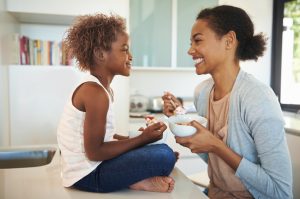 Mother and Child Sharing Bowl of Healthy Breakfast Food in Kitchen | Vitacost.com/blog
