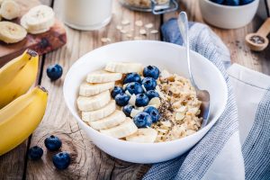 White Bowl Filled with Oatmeal, Blueberries & Banana Slices | Vitacost.com/blog