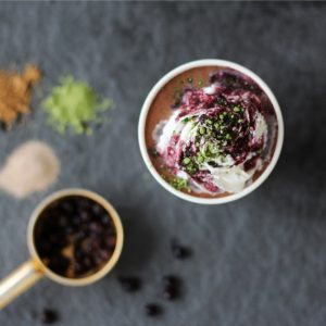Overhead Shot of Frappe Smoothie with Berry Drizzle & Matcha Powder on Slate #recipe| Vitacost.com/blog