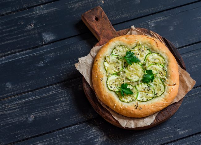 Nut- & Dairy-Free Pesto Pita Pizza Nut- & Dairy-Free Pesto Pita Pizza on Rustic Cutting Board | Vitacost.com/blog