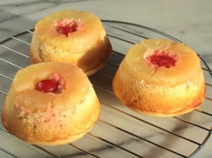 3 Pineapple Upside Down Cupcakes on Wire Drying Rack #recipe | Vitacost.com/blog