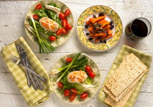 Matzo & Other Kosher Foods on Colorful Dishes on Wooden Table | Vitacost.com/blog