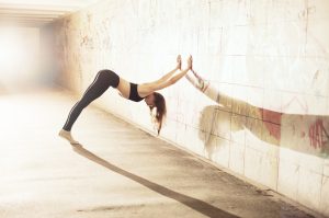 Woman Practicing Yoga with Wall to Strengthen Core | Vitacost.com/Blog