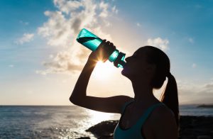 Woman Drinks Out of Eco-Friendly Reusable Water Bottle | Vitacost.com/Blog