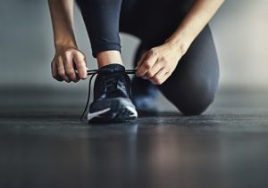 Woman Tying Shoelaces Before Workout | Vitacost.com/Blog