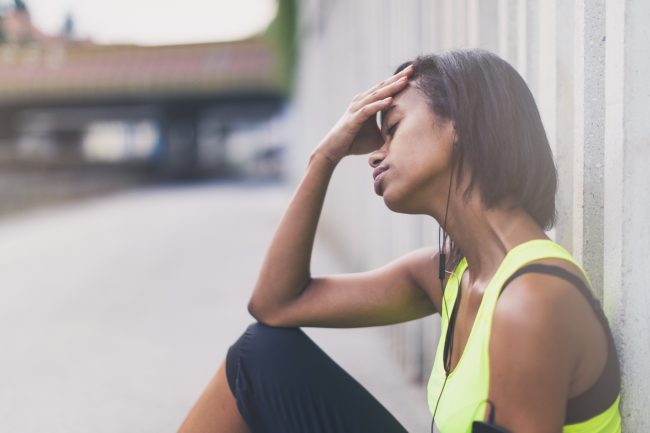 Woman Sits on Ground Too Tired to Get Back on Track with Exercise | Vitacost.com/blog