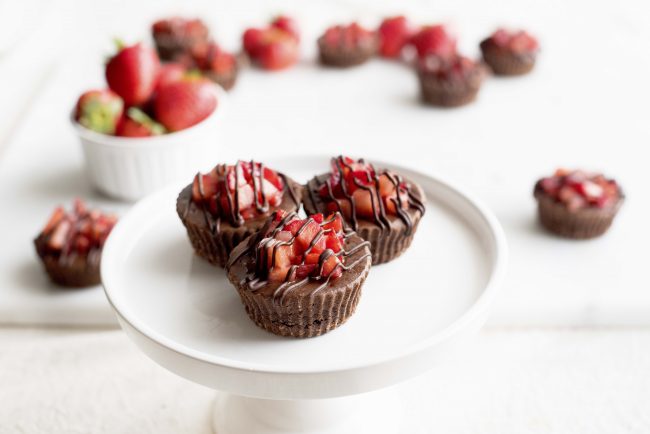 Overhead Shot of 3 Mini Chocolate Strawberry Cheesecakes on White Cake Stand | Vitacost.com/blog