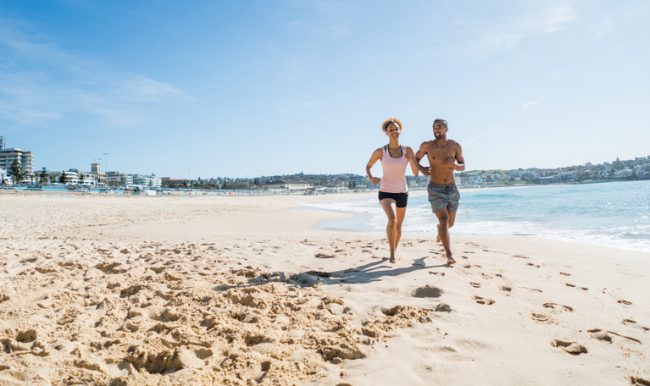 Couple Jogging on Beach to Maintain Weight Loss this Summer | Vitacost.com/blog