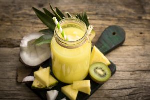 Tropical Protein Smoothie on Cutting Board with Ingredients | Vitacost.com/blog
