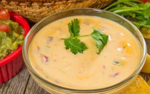 Vegan Cashew Cheese Dip in Glass Bowl with Cilantro Garnish | Vitacost.com/blog