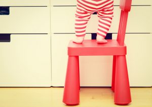 Baby Climbing on Chair, Reaching for Dangerous Household Items on Counter | Vitacost.com/Blog