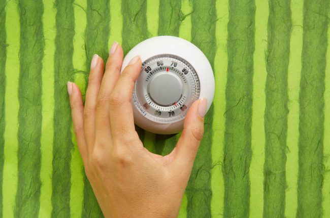 4 Energy Saving Tips for Summer Hand Turning Up Temperature on Thermostat to Save Energy for Summer | Vitacost.com/blog