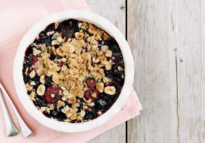 Baked Blueberry Oatmeal for One in Ramekin on Wood Table #recipe | Vitacost.com/blog
