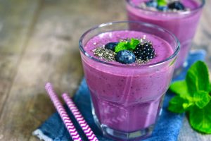 Berry Orange Smoothie with Chia Seeds in a Glass on Rustic Table | Vitacost.com/blog