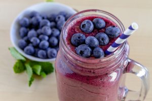 Mason Jar Filled with Vanilla Blueberry Smoothie and Fresh Blueberries | Vitacost.com/blog