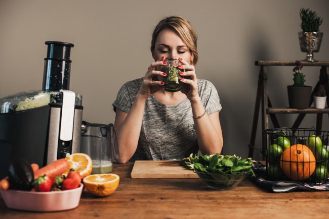 Woman on Fasting Diet Making Fresh Green Juice | Vitacost.com/Blog