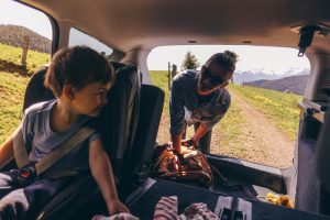 Mom and Son Packing Car with Healthy Snacks for Family Road Trip | Vitacost.com/Blog