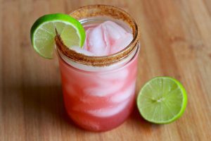 Pomegranate Margarita in Mason Jar With Lime Wedge & Coconut-Sugar-Coated Rim #recipe | Vitacost.com/blog