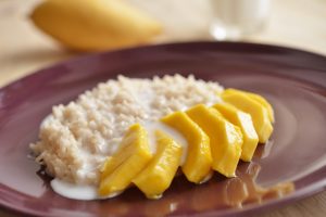 Sweet Sticky Rice with Mango Slices & Coconut Milk on Purple Plate | Vitacost.com/blog