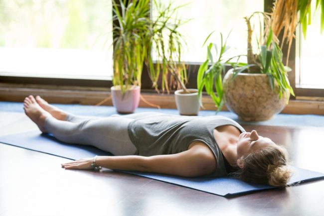 Woman at Home Practicing Yoga to Relieve Stress, Depression & Anxiety | Vitacost.com/Blog