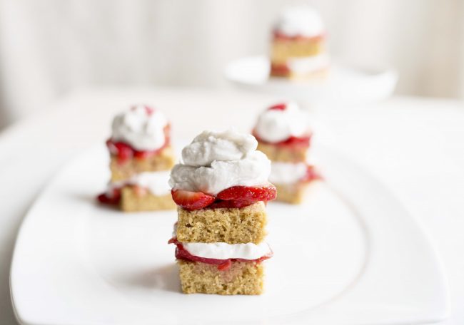 Gluten-Free Strawberry Shortcake 4 Gluten-Free Strawberry Shortcakes with Coconut Cream on White Plate | Vitacost.com/blog