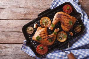 Sweet and Spicy Grilled Chicken Thighs with Lemon & Tomato Slices on Cast Iron Grill Pan | Vitacost.com/blog