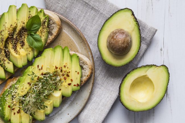 Avocado Oil Benefits Can Also Be Found in This Avocado Toast on White Wood | Vitacost.com/blog
