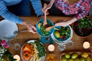 Woman Serving Salad on Plate, Eating Light with Summer Food | Vitacost.com/blog