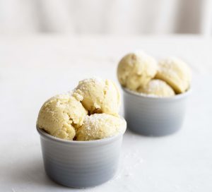 2 Gray Bowls of Mango-Coconut Milk Ice Cream on White Marble Counter #recipe | Vitacost.com/blog