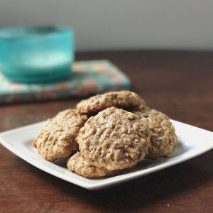 Plate of Macadamia Nut & Peanut Butter Cookies on Wood Table #recipe | Vitacost.com/blog