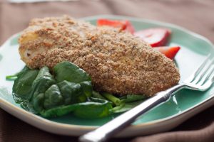 Paleo Fried Coconut Chicken on Teal Plate with Spinach & Fork | Vitacost.com/blog