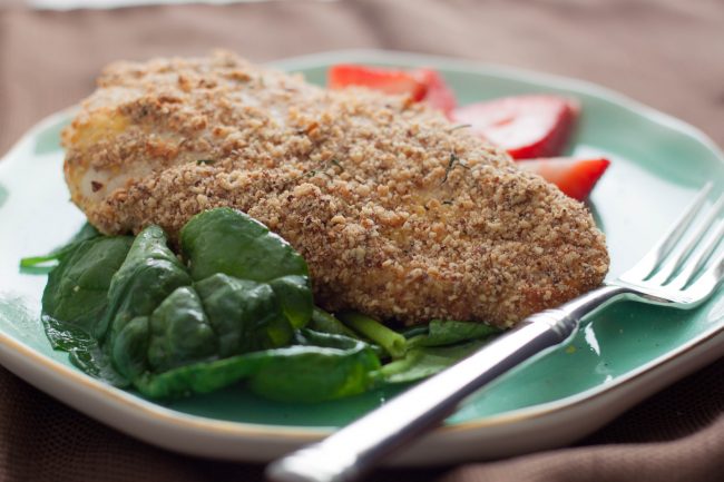 Paleo Fried Coconut Chicken on Teal Plate with Spinach & Fork | Vitacost.com/blog