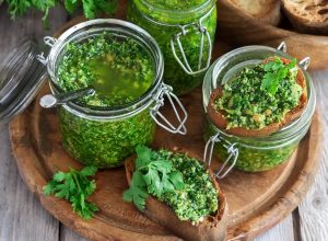 Moringa Cilantro Pesto in Jars on Wooden Backgrounbd | Vitacost.com/blog