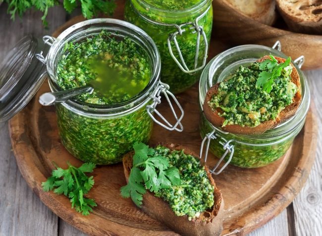 Recipe: Spicy Moringa & Cilantro Pesto Moringa Cilantro Pesto in Jars on Wooden Backgrounbd | Vitacost.com/blog
