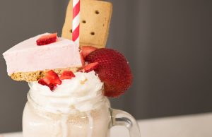 Gluten-Free Strawberry Cheesecake Milkshake in Mason Jar with Cheesecake Toppings | Vitacost.com/blog
