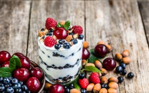 Vegan Yogurt Parfait on Wood Background with Berries, Cherries and Nuts | Vitacost.com/blog
