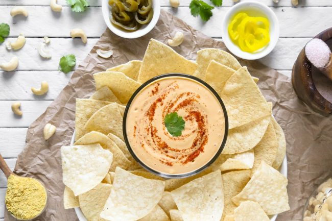 Vegan Cheese Sauce in Bowl Surrounded by Tortilla Chips | Vitacost.com/blog