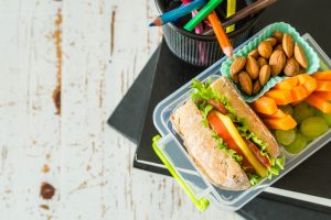 Lunch Box Packed with Healthy Foods on Desk with Pencil Holder | Vitacost.com/Blog