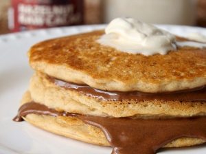 Stack of Gluten-Free Pancakes with Chocolate Spread and Coconut Whipped Cream | Vitacost.com/blog