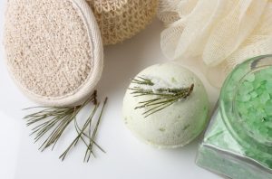 DIY Bath Bomb Made with Essential Oils Beside Other Bath Supplies on White Table | Vitacost.com/blog