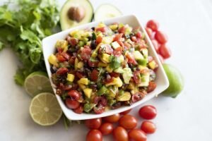 White Bowl Full of Peach Jam Salsa with Avocado, Tomatoes & Limes #recipe | Vitacost.com/blog