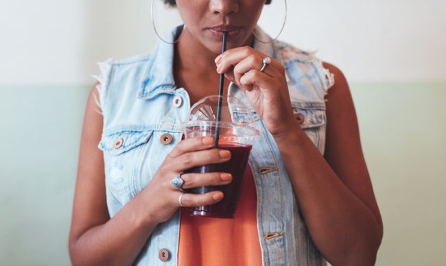 Woman Using Creative Ways to Protect the Environement Drinking From Biodegradable Straw | Vitacost.com/blog